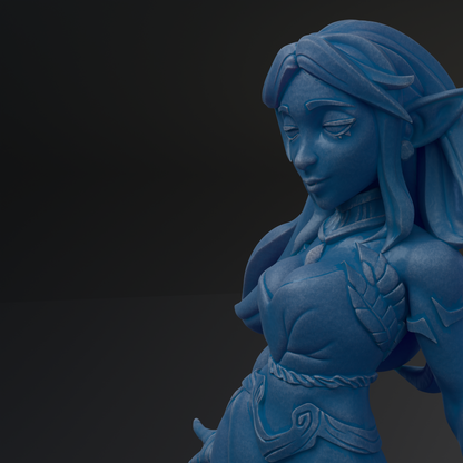 A blue figurine of a female character with long hair and a flowing dress, set against a dark background.