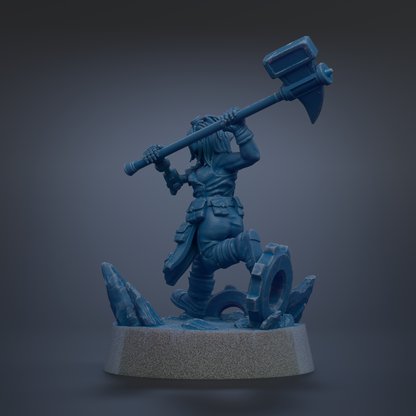 A blue figurine of a warrior wielding a large hammer, standing on a rocky base.