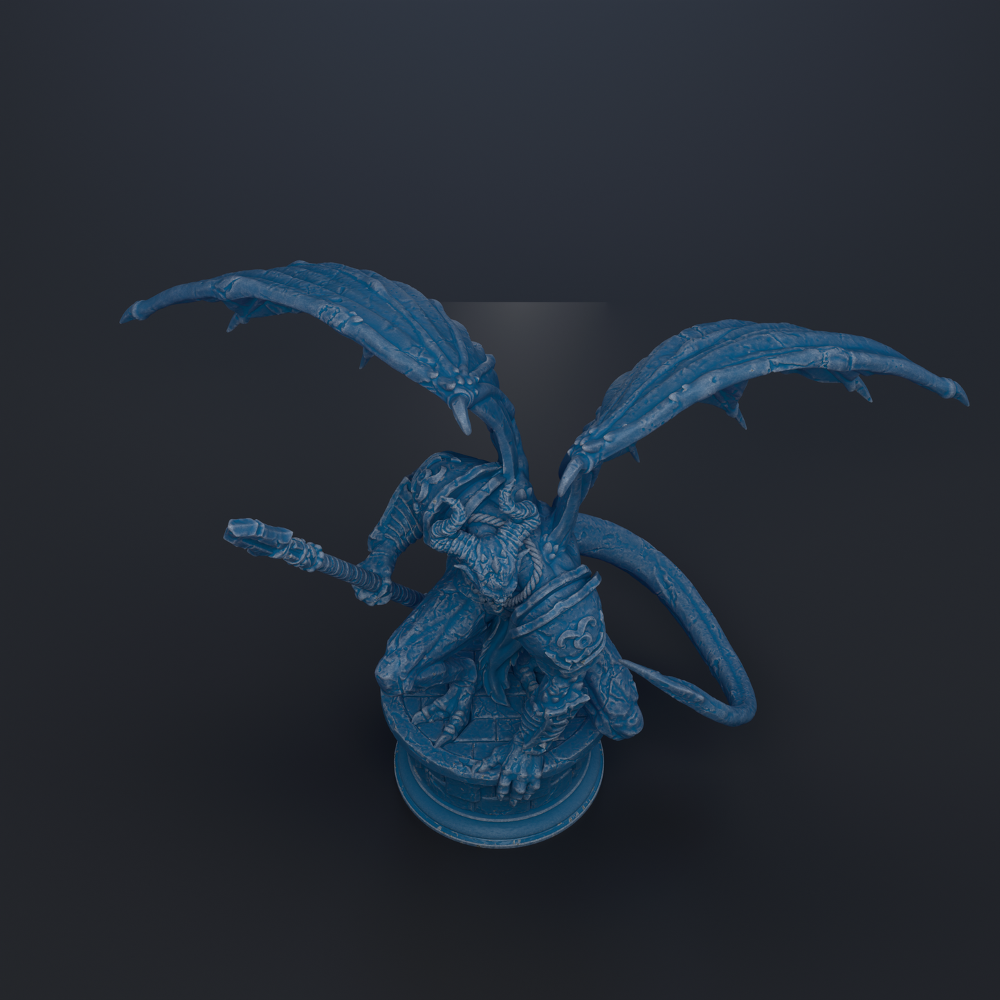 A blue dragon statue with wings and a tail, standing on a pedestal against a dark background.