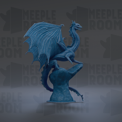 A blue dragon statue with outstretched wings stands on a rock against a dark background.