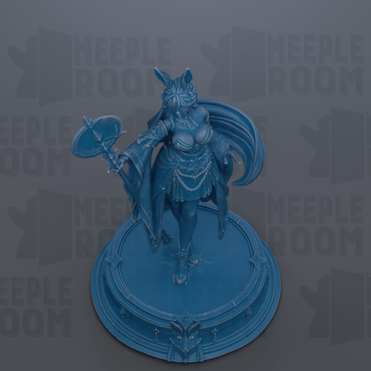 A blue figurine of a woman with a large headdress and flowing hair, standing on a circular base.