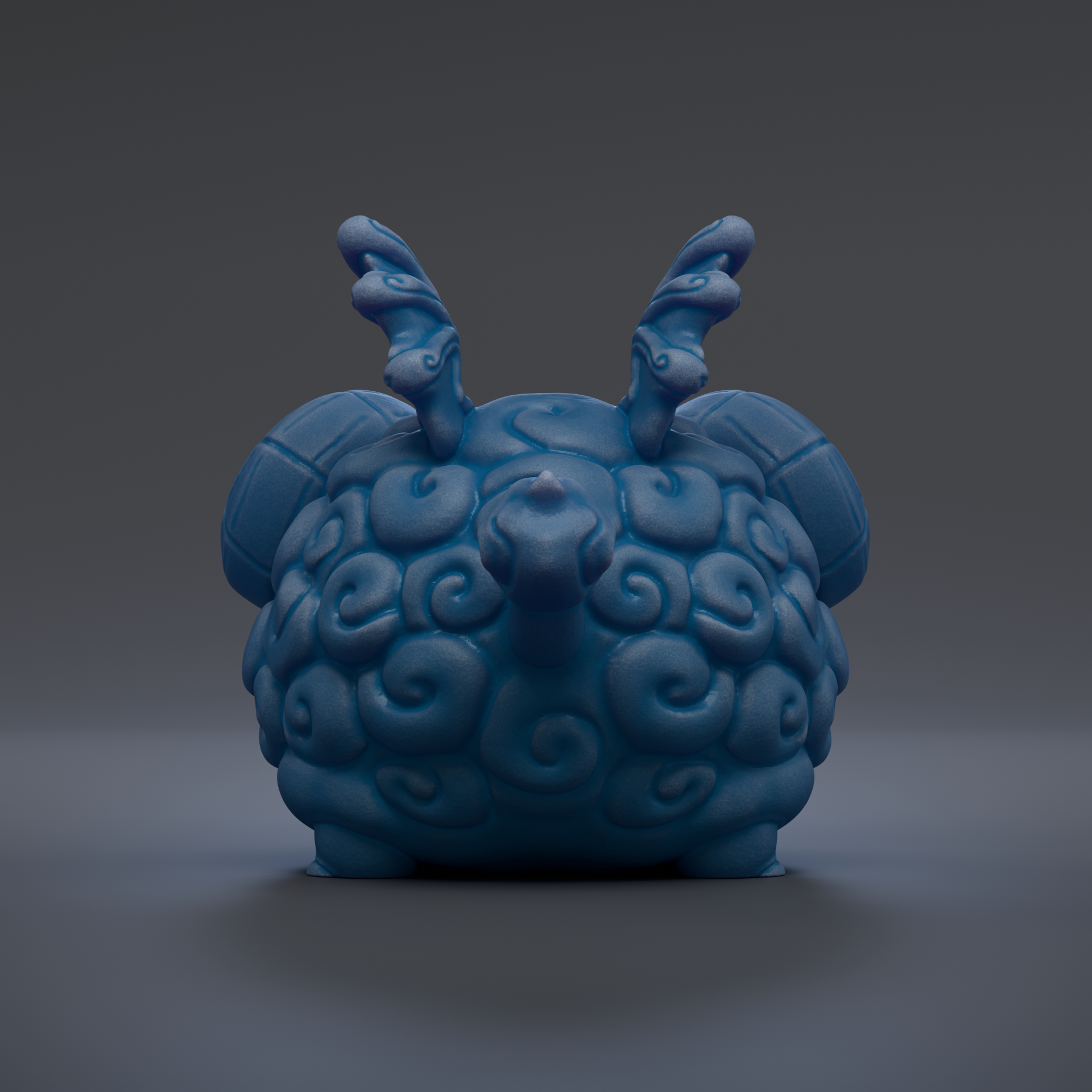 A blue, sculpted figurine with a unique, abstract design and two curved horns.