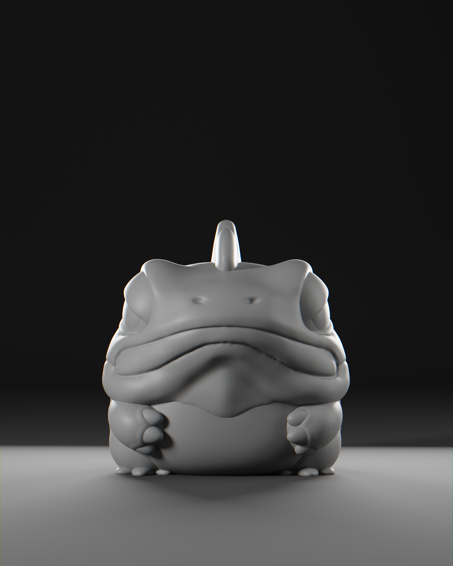 a white frog sitting on top of a table