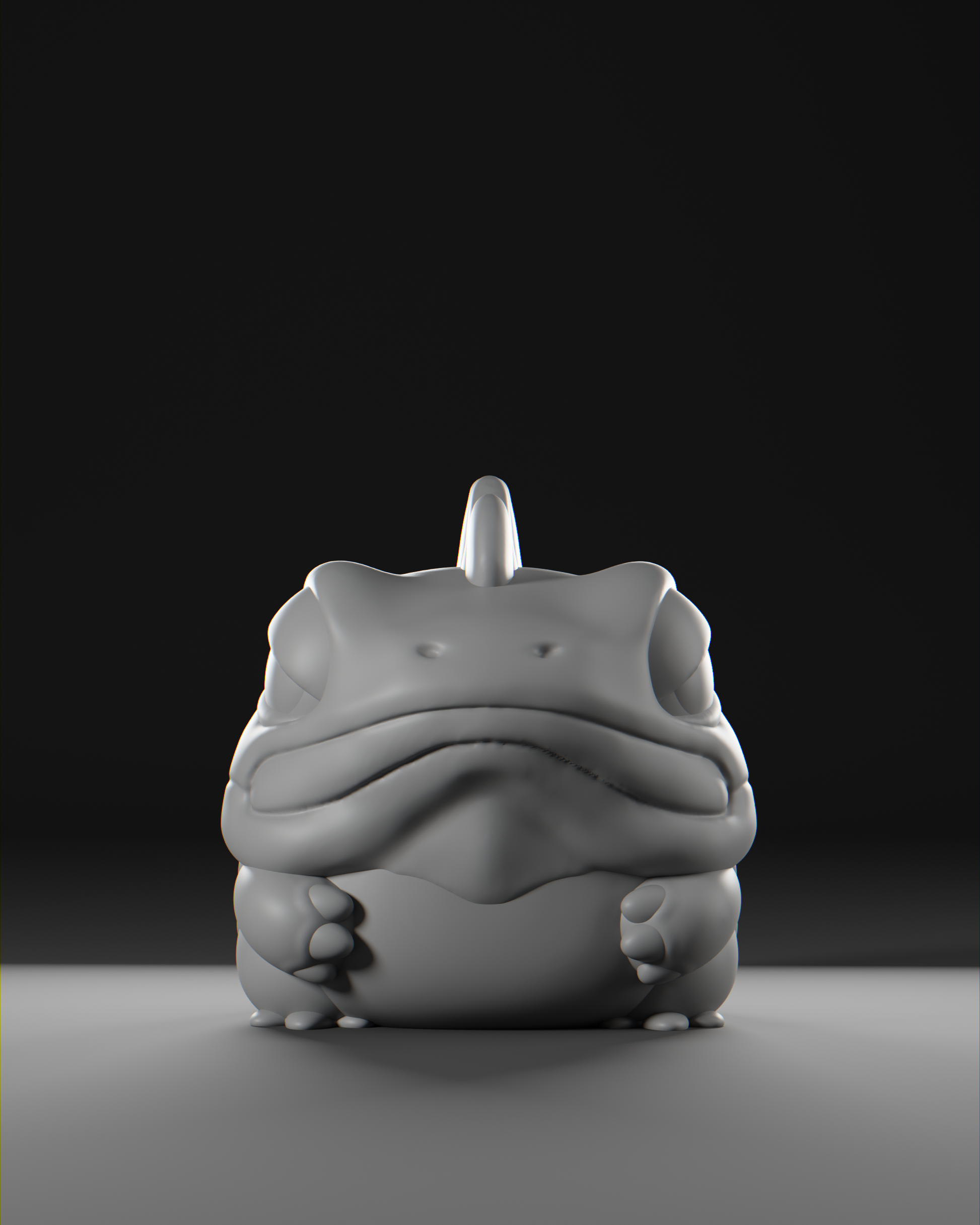 a white frog sitting on top of a table