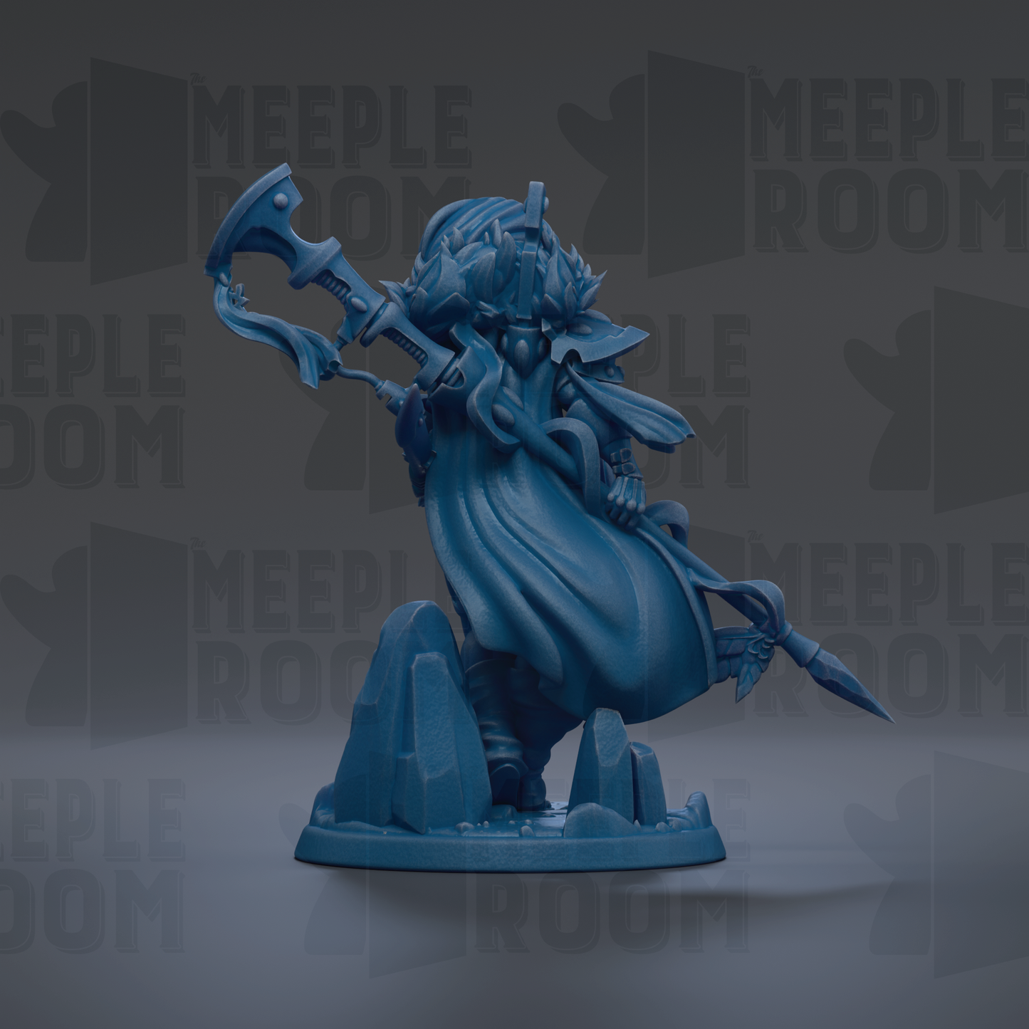 A blue figurine of a character with a long, flowing robe and a large weapon, standing on a rock formation.