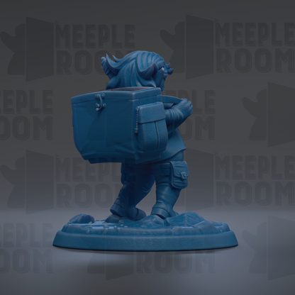 A blue figurine of a person carrying a large blue box, standing on a platform.