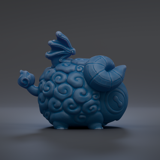 A blue, whimsical ceramic figurine with a dragon-like head and curled horns, sitting on a dark surface.