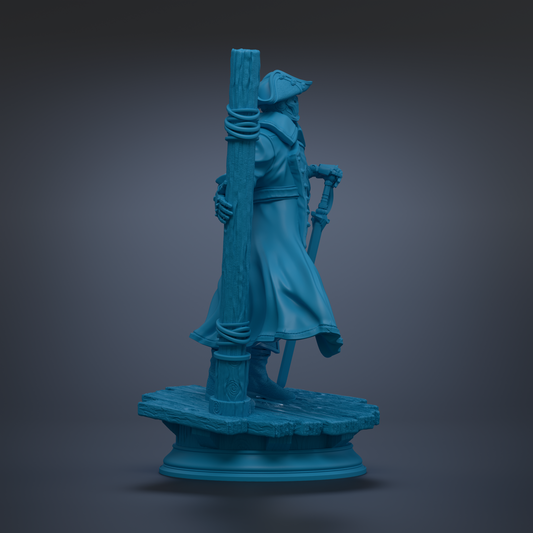 A blue statue of a person standing on a pedestal, holding a staff and wearing a hat.