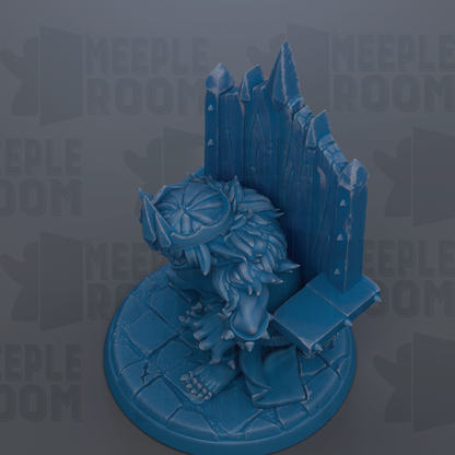 A blue figurine of a fantastical creature, possibly a dragon or a mythical being, sitting on a pedestal or base.