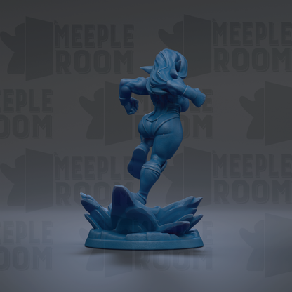 A blue figurine of a female character is shown in a dynamic pose, standing on a platform with a textured surface.