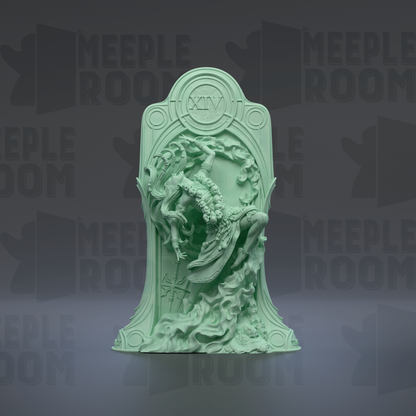 a green, ornate sculpture with intricate details, including a central figure surrounded by a decorative frame.
