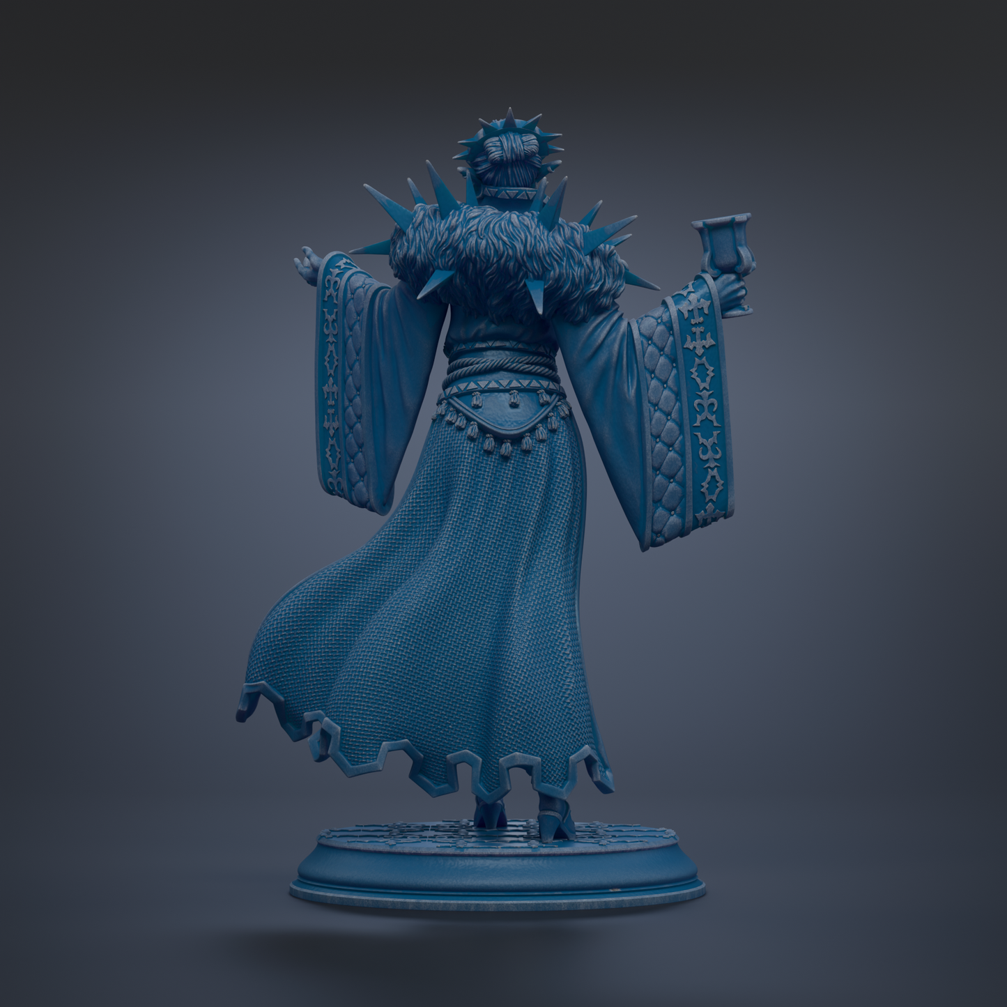 A statue of a person wearing a long, flowing robe with spikes on the back, holding a cup in their hand.