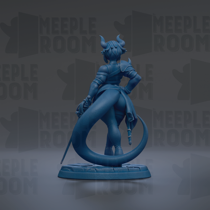 A blue figurine of a dragon-like creature with horns and a tail, standing on a base and holding a sword.