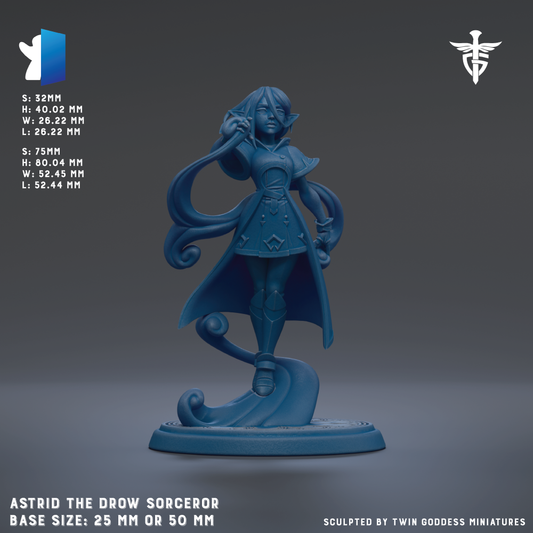 The image is a 3D rendering of a blue figurine of a female character, likely representing a witch or magical being. The figurine is standing on a base and has a flowing cape. The image is described as a "base size: 25mm or 50mm" and is "sculpted by Twin Goddesses miniatures".