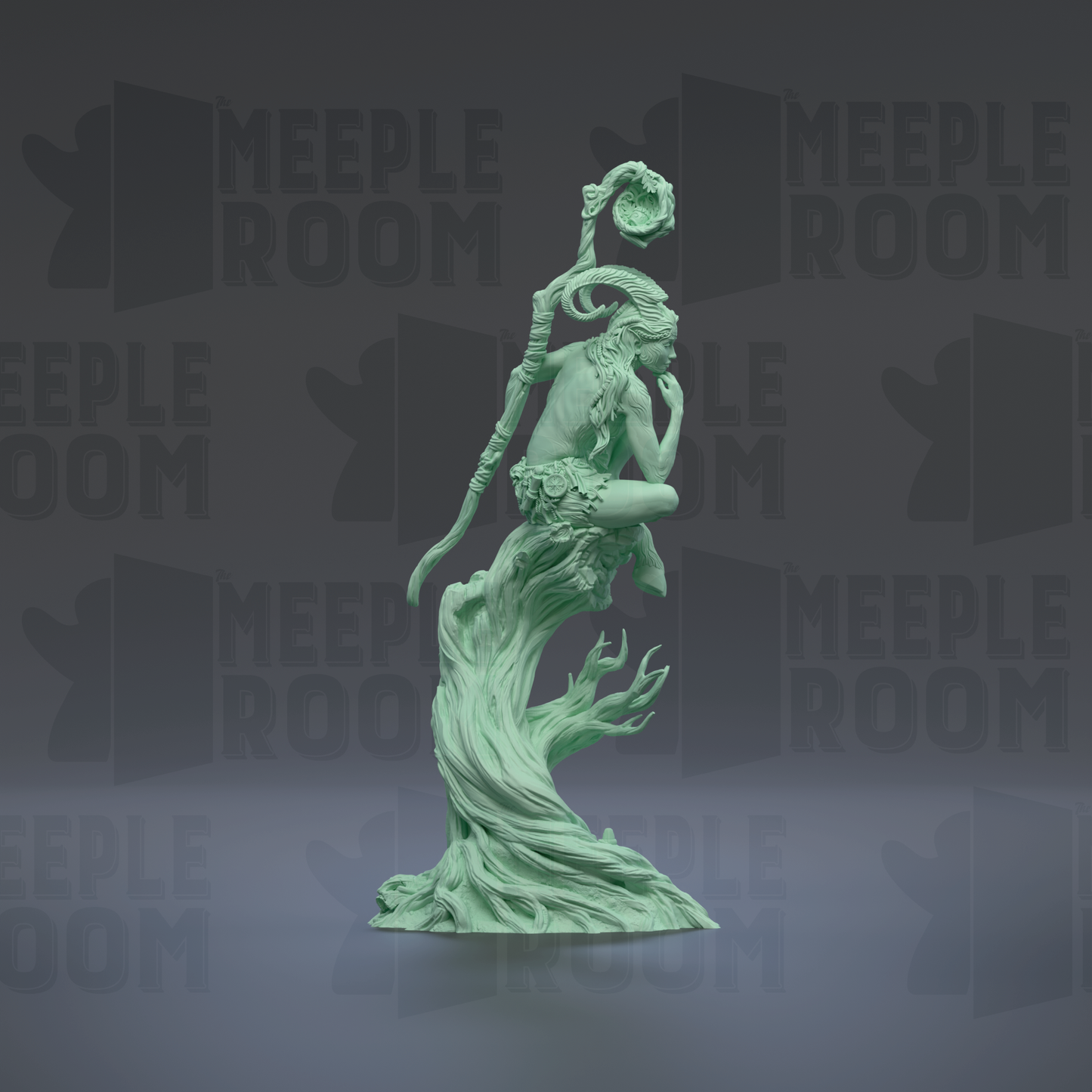 A green statue of a woman with a staff and flowing hair, standing on a rock formation.