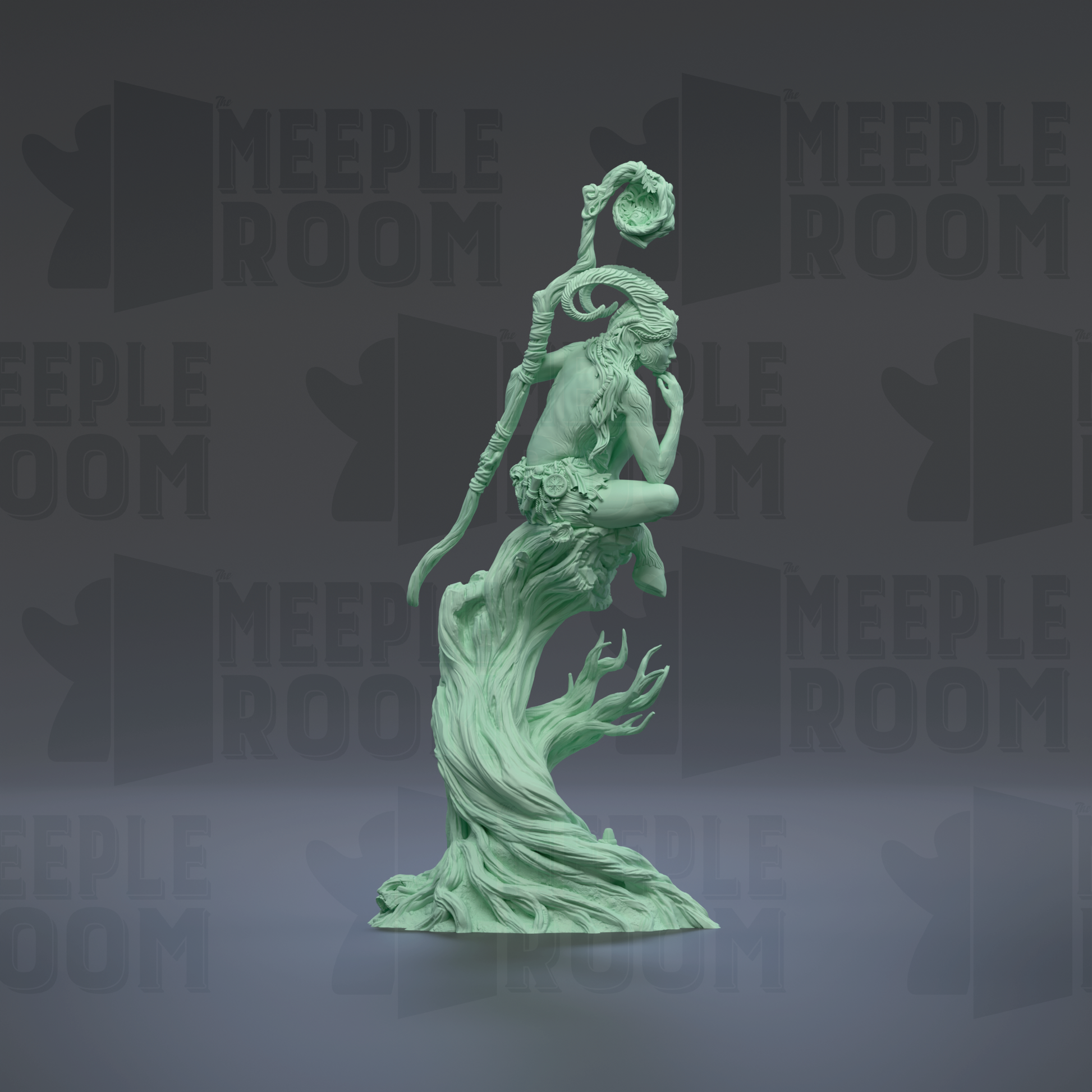 A green statue of a woman with a staff and flowing hair, standing on a rock formation.