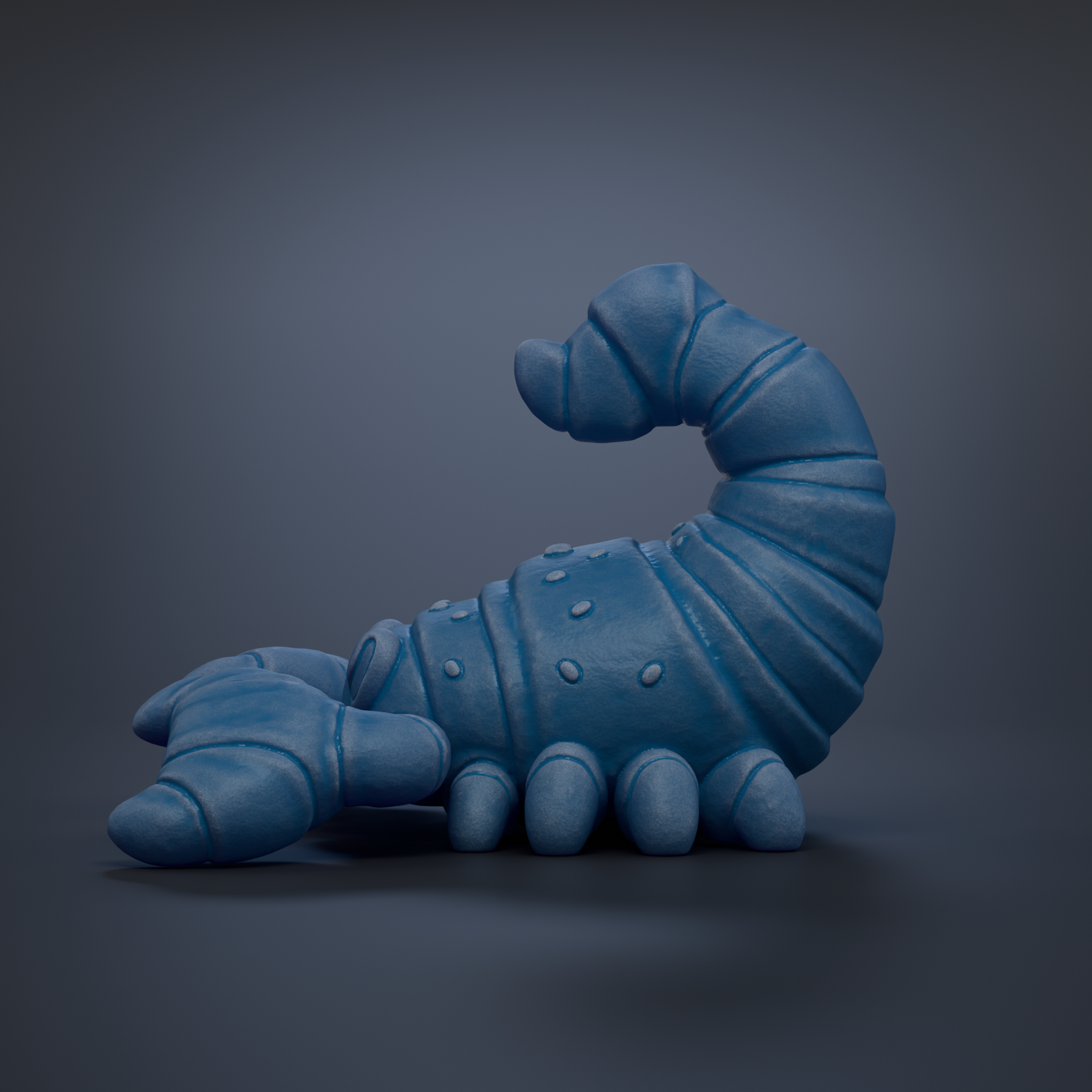 A blue, 3D-rendered toy scorpion is shown against a dark background.