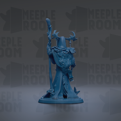 A blue figurine of a wizard or magical figure, holding a staff and wearing ornate robes and headdress, standing against a dark background with repeated text.