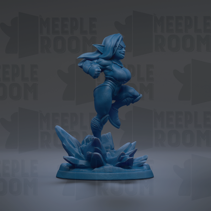A blue figurine of a female character is shown in a dynamic pose, standing on a base with a rocky terrain.