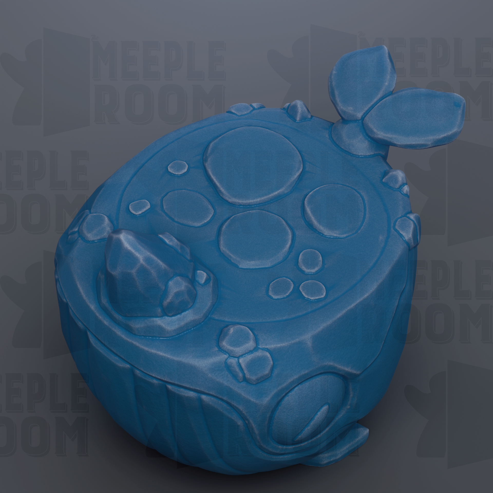 A blue, spherical object with a textured surface and circular shapes, resembling a toy or figurine.