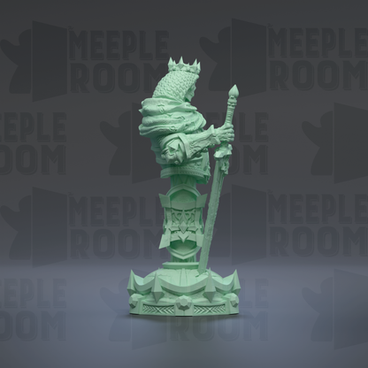 A green statue of a figure holding a sword and shield, standing on a pedestal with a geometric base.