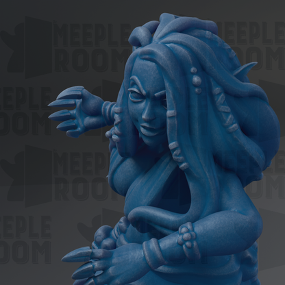 A blue, sculpted figure with long hair and a fierce expression, holding a weapon in its hand.