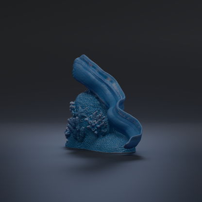 A blue, abstract sculpture resembling a wave or sea creature is shown against a dark background.