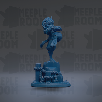 A blue figurine of a person standing on a pedestal, with a rope and other objects around it.