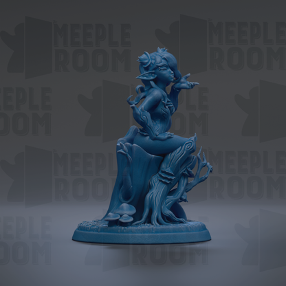 A blue figurine of a fantastical creature sitting on a tree stump, surrounded by mushrooms and other natural elements.