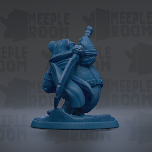 A blue figurine of a character with a sword and shield, standing on a base.