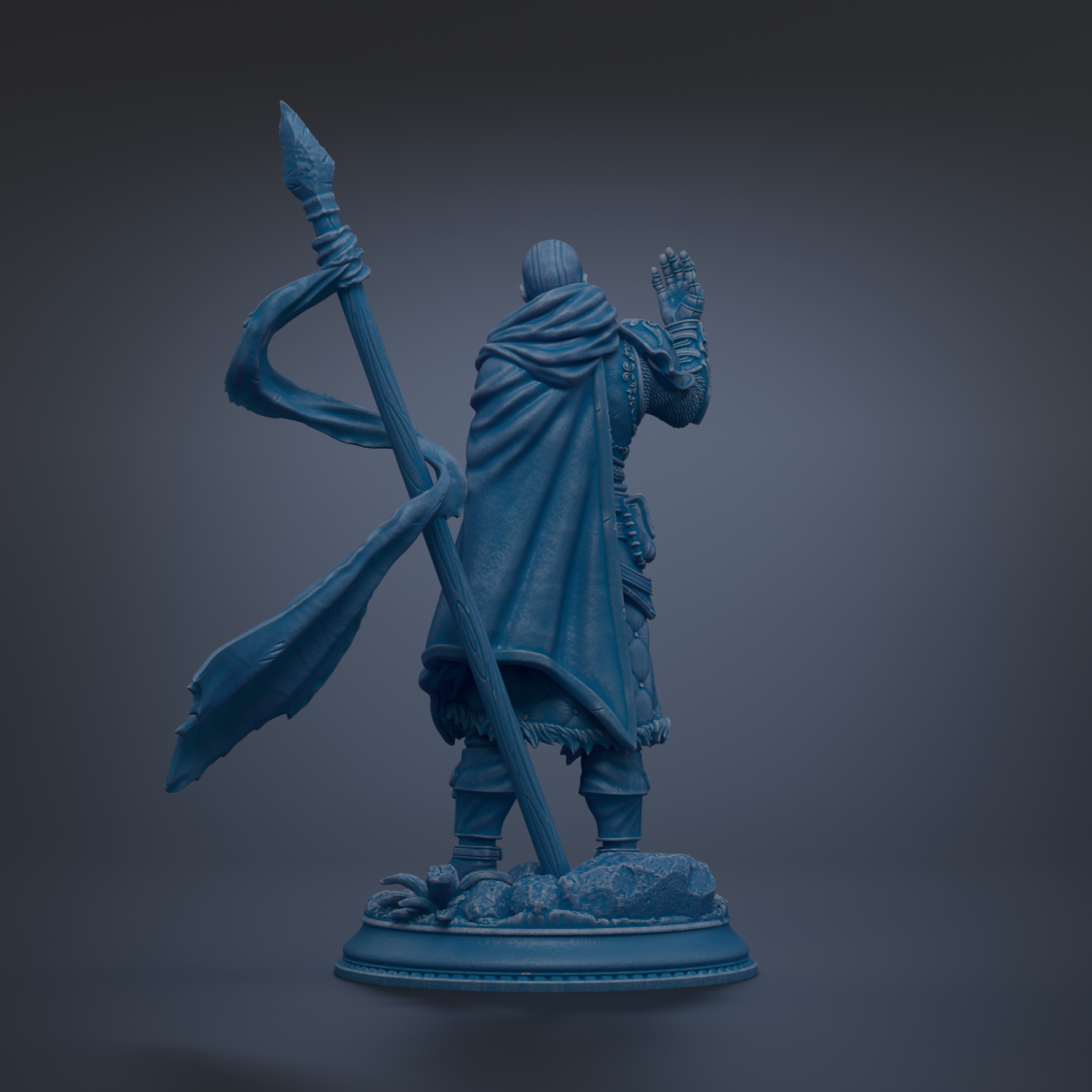 A blue statue of a person holding a spear and standing on a rock.