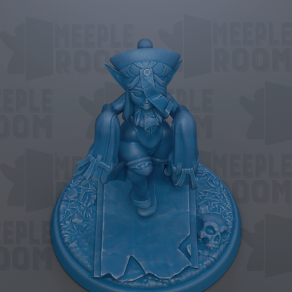 A blue figurine of a person sitting on a base with a skull and other decorative elements.
