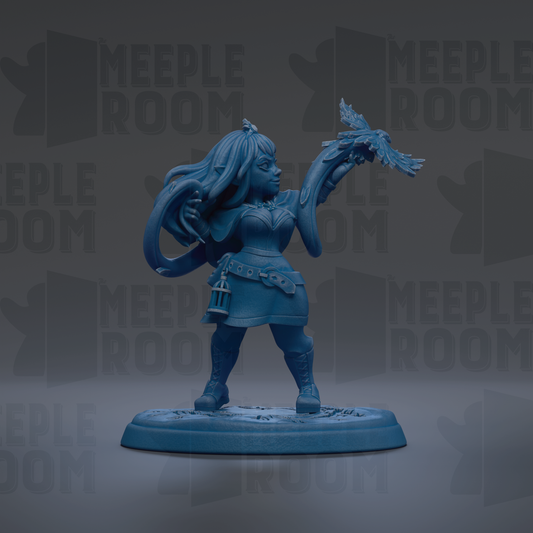 A blue figurine of a woman holding a bird, standing on a base.