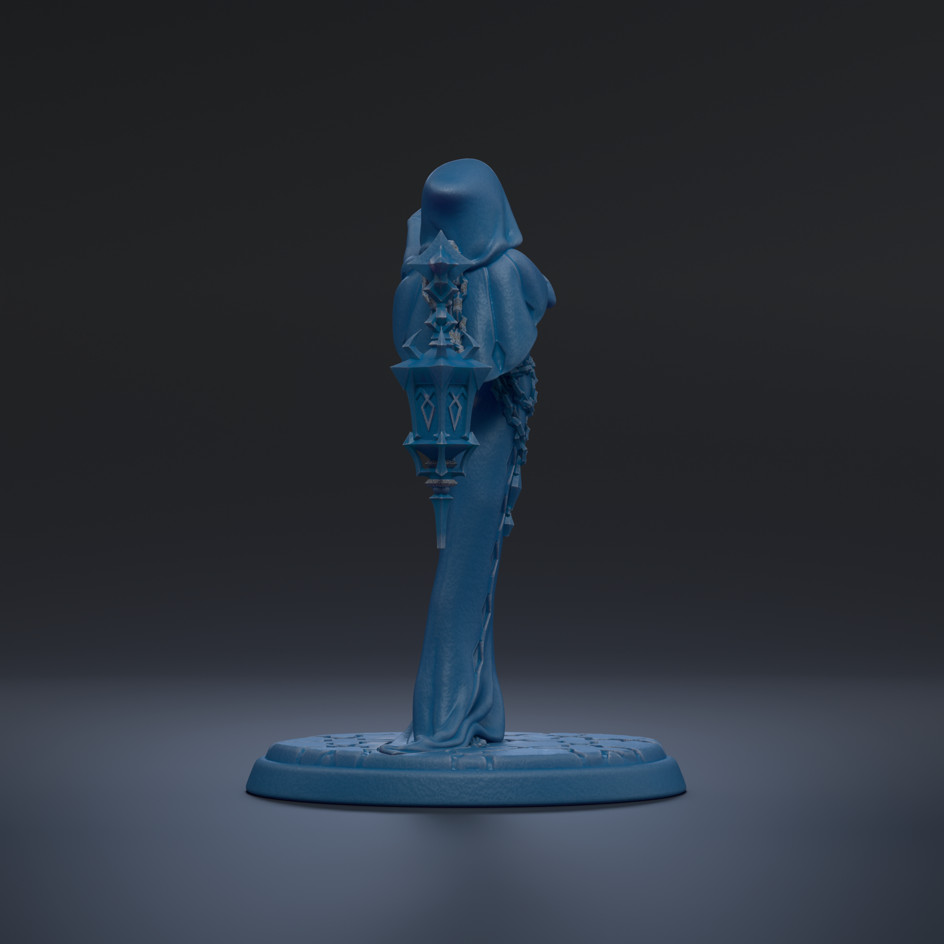 A blue statue of a person standing on a base, with a dark background.