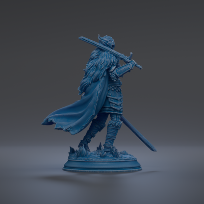 A blue statue of a warrior figure holding a sword and shield, standing on a base with a flowing cape.