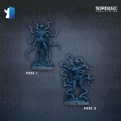 two blue figurines with long, coiled bodies, possibly representing creatures or characters from a video game or other media.