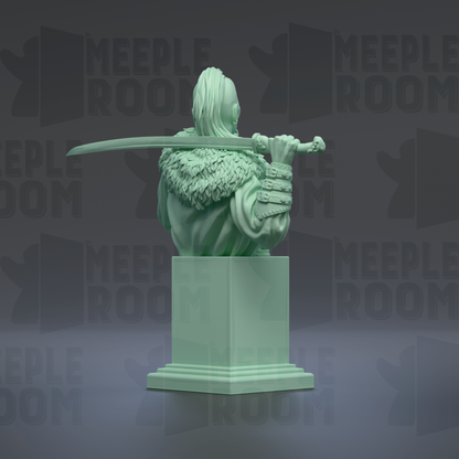 A green statue of a person holding a sword and wearing a fur-trimmed cape, standing on a pedestal.