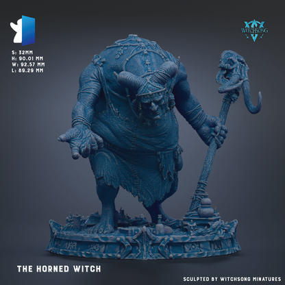 a large, detailed statue of a horned witch, with intricate details and a prominent horn on her head.