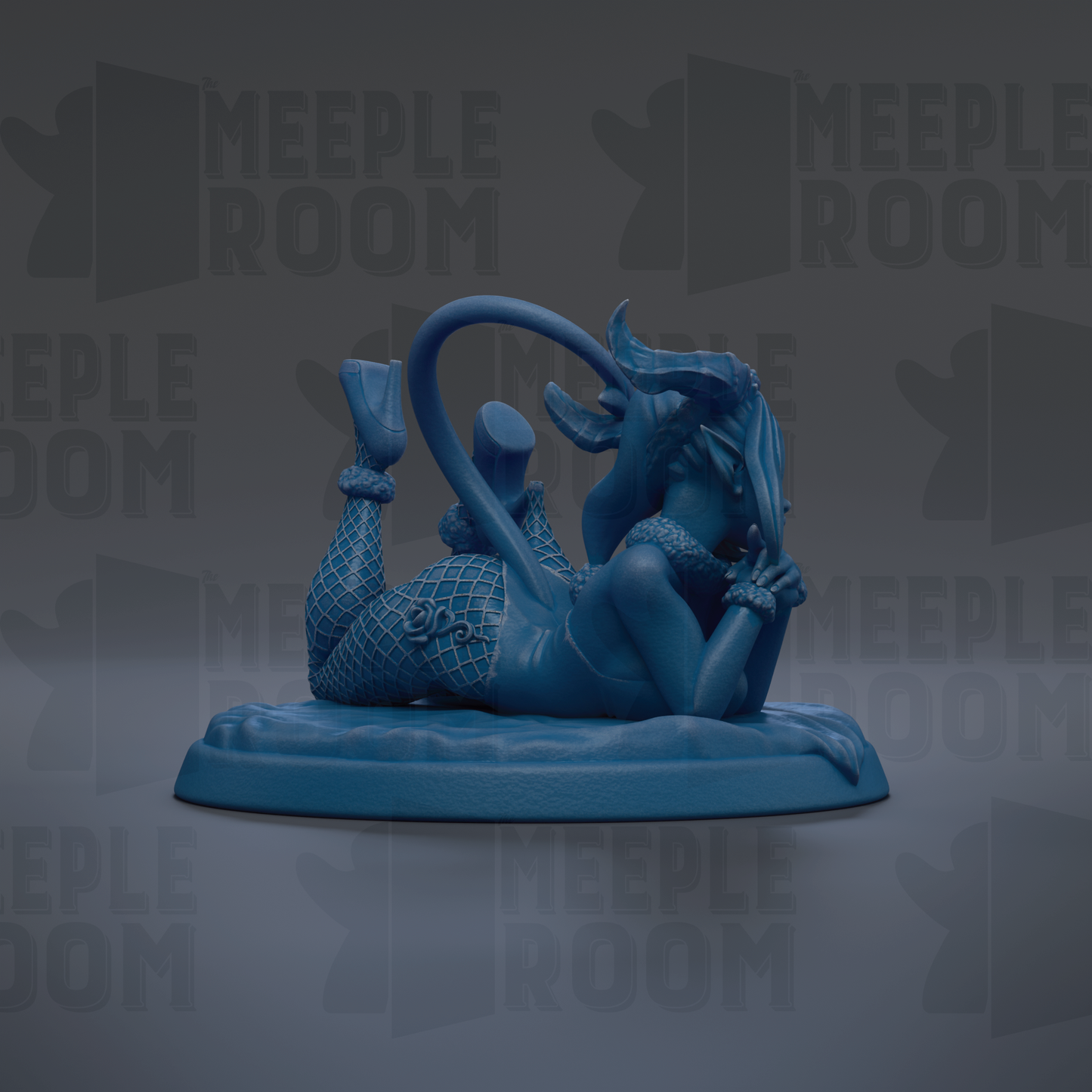 A blue figurine of a woman with a horn-like object on her head, lying on her stomach with her legs crossed.