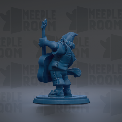 A blue figurine of a person playing a guitar, standing on a base.