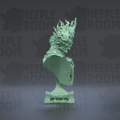 a green bust sculpture with a stylized, abstract design.