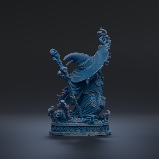 A blue, 3D-rendered statue of a wizard or magical figure, with intricate details and a flowing robe, standing on a pedestal against a dark background.