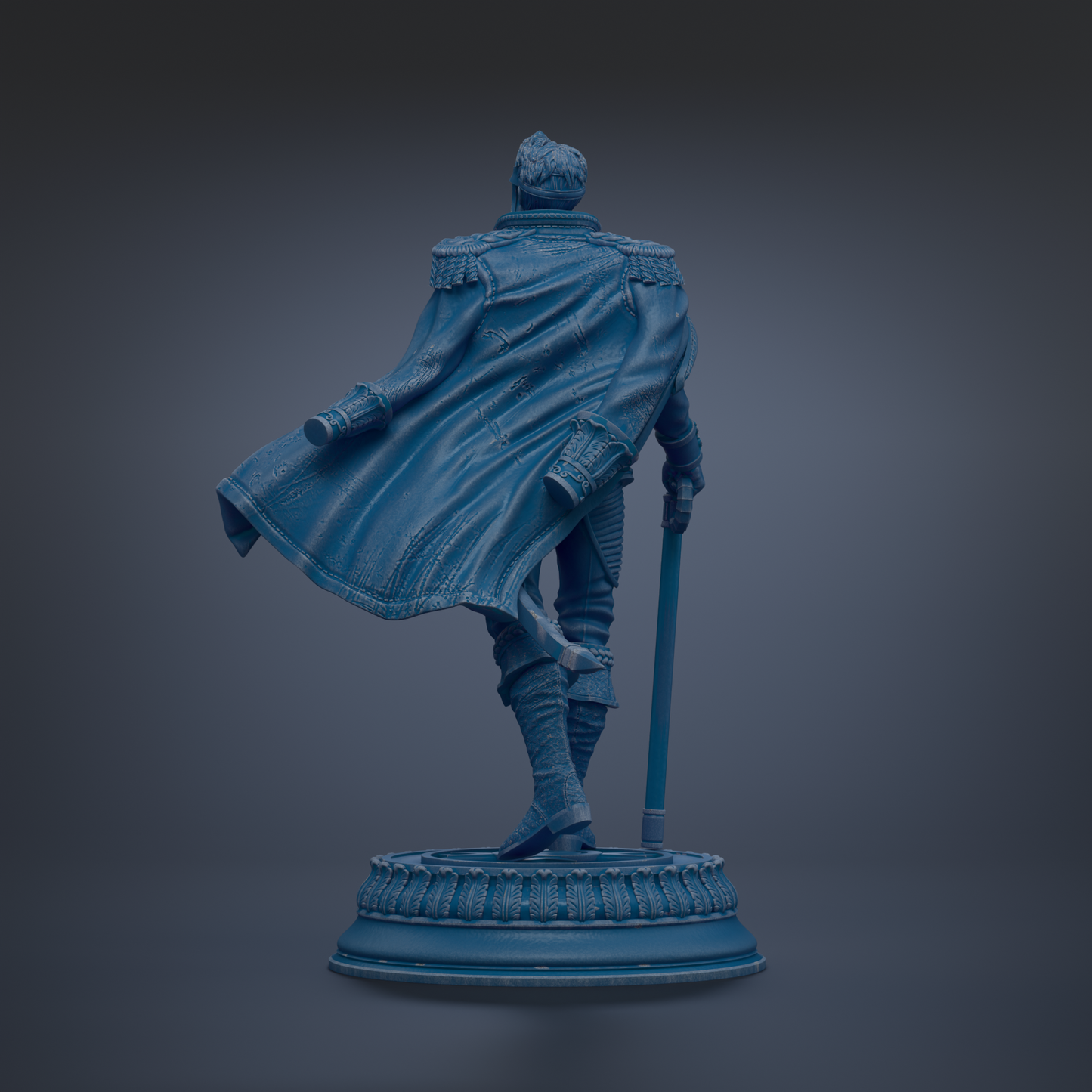 A statue of a person in a cape, standing on a pedestal.
