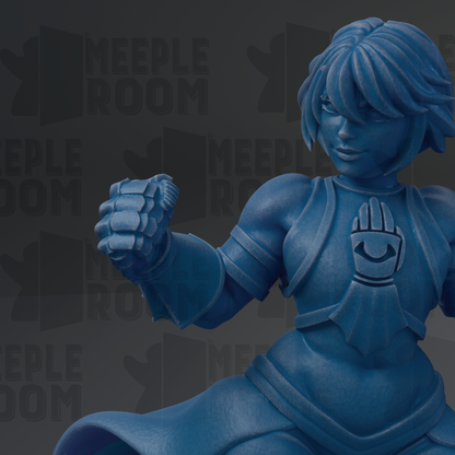 A blue figurine of a female character with short hair and a determined expression, wearing a blue outfit with a distinctive emblem.