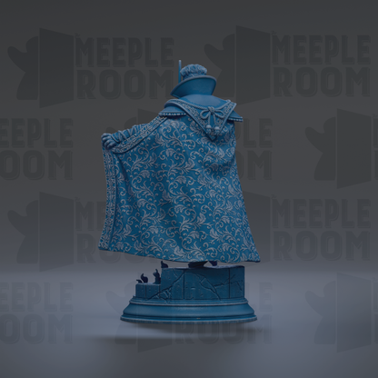 A statue of a person wearing a blue and white patterned cape, standing on a pedestal.