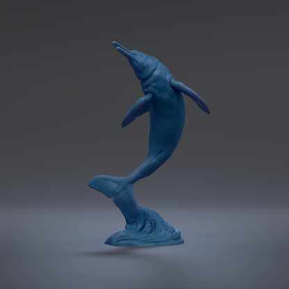 A blue plastic dolphin figurine is shown against a dark background.