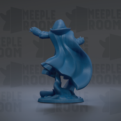 A blue figurine of a person with a hooded cloak, standing on a base and facing away from the camera.