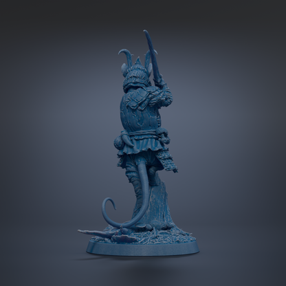 A blue figurine of a fantastical creature, possibly a dragon or serpent, standing on a rock and holding a weapon.