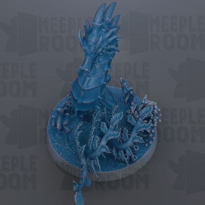 A blue, 3D-rendered dragon-like creature with sharp teeth and claws, standing on a circular base with a textured surface.