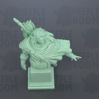 A green statue of a person with a long beard and flowing hair, wearing a cape, standing on a pedestal.